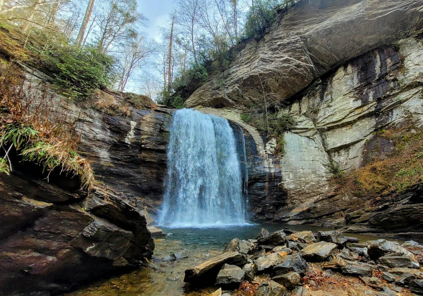A small waterfall in the middle of a rocky area